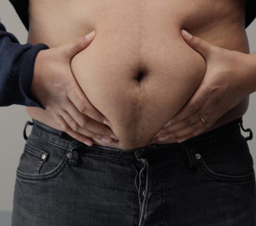 overweight man closeup belly front view put up shirt pinch clap belly